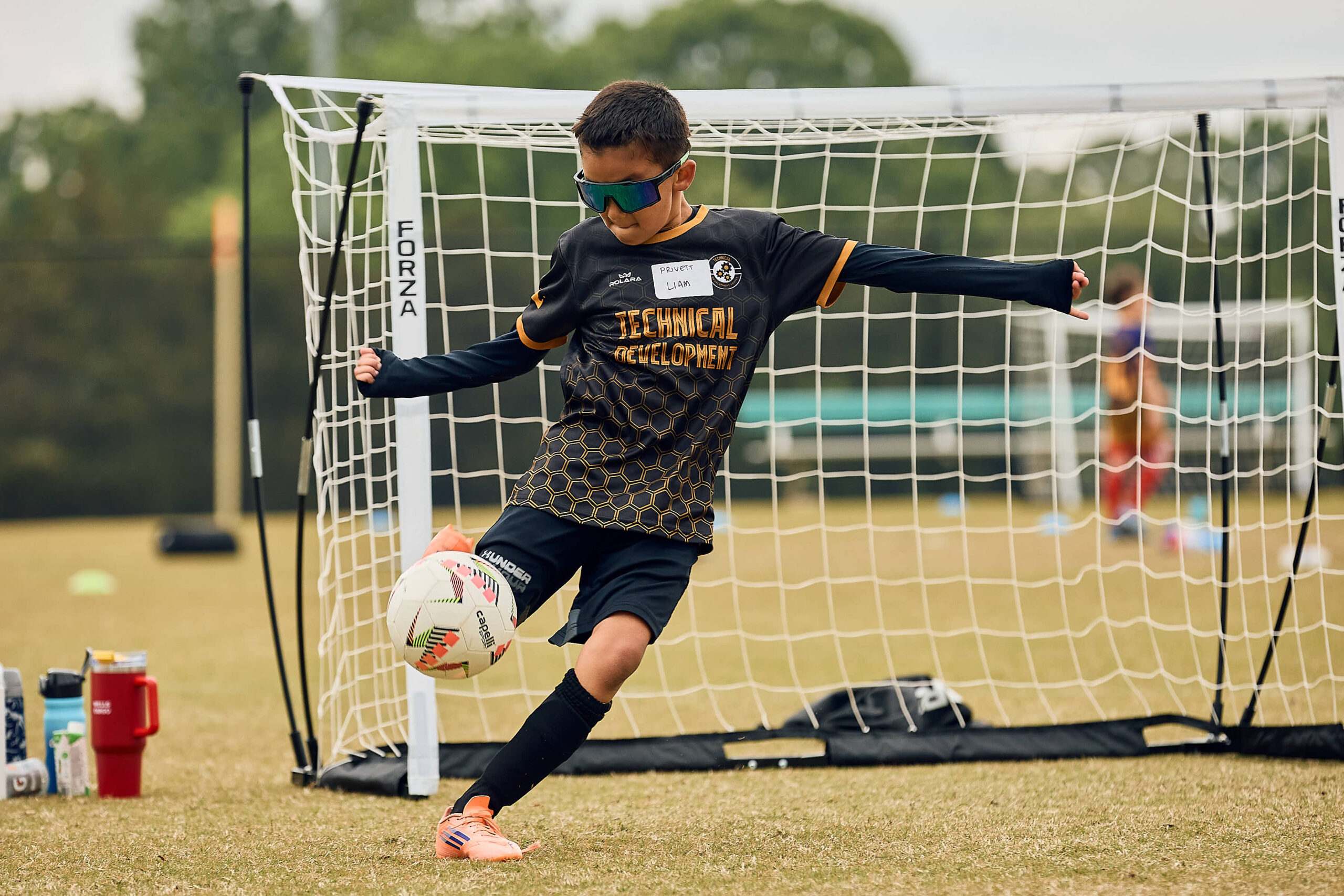 Technical Development Center player controlling the ball during an outdoor training activity